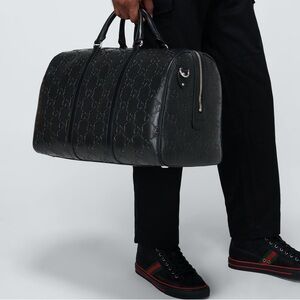 New! Gucci GG embossed black leather duffel bag